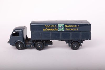 a toy truck that is sitting on a white surface