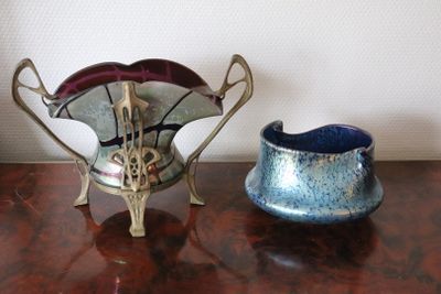 two vases that are sitting on a table