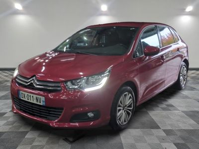 the red citrole is parked on a checkered floor