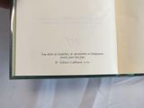 someone is holding a book open to a page with a quote on it