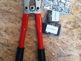 a pair of pliers that are laying on a table