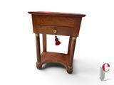 a small wooden table with a drawer on top of it