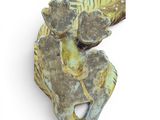 a figurine of an elephant holding a piece of wood