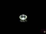 a close up of a white diamond on a black surface