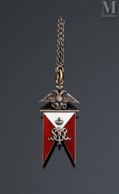 a close up of a medal on a chain on a gray background