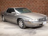 a picture of a silver car parked in a parking lot