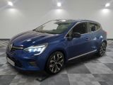 a blue car parked in a garage with a checkered floor