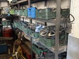 many baskets on the shelves in the garage