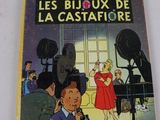livre pour enfants français, *Les Bijoux de la Castafore*, avec l'illustration d'une femme en robe rouge