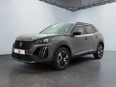 a grey suv parked in a large room with white walls