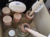 a box with a lot of bottles and some chopsticks in it