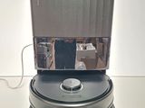 someone is taking a picture of a roomba with a mirror on top of it