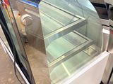 an image of a glass display case in a factory