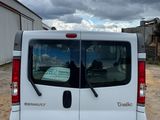 a white van that is parked in the dirt