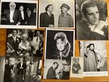 several old black and white photos of men and women on a table
