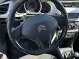 dashboard view of a car with a steering wheel and dashboard controls