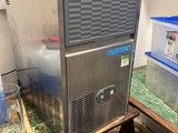 an image of a small ice machine in a room