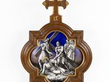 a wooden cross with a picture of jesus on it