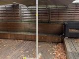 an umbrella that is sitting on a wooden deck