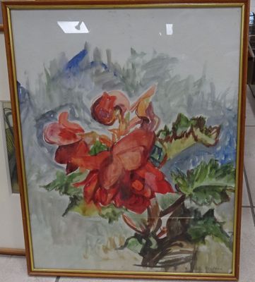 un tableau représentant une fleur rouge dans un cadre doré