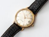 an image of a close up of a wrist watch on a white surface