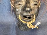 a woman that is holding a mask on her head