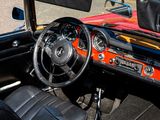 a red and black car with a steering wheel and dashboard