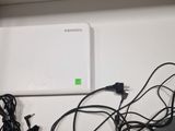 an image of a bunch of wires and cords on a shelf