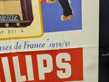 a poster for philips radio on the wall of a building