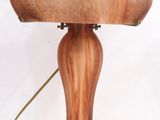 a wooden lamp that is sitting on a table