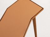 a small wooden table with a mirror on top of it