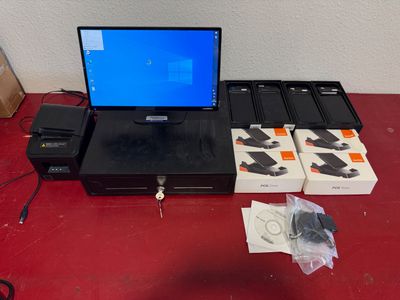a laptop computer sitting on top of a red table