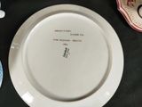 a white plate with writing on it sitting on a table