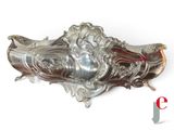 a silver object on a white background with a red and white logo