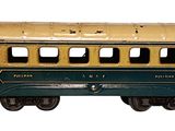 a small green and yellow train car on a white background