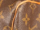 a close up of a brown louis vuitton bag