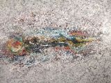 une peinture représentant un poisson sur le mur d'un immeuble