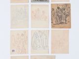 Plusieurs dessins représentant des personnes et des animaux sont exposés sur une surface blanche.