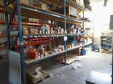 many shelves with various items on them in a warehouse