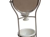 an image of a toilet with a mirror on it