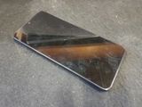 a cell phone that is laying on the ground