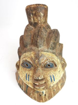 an image of a wooden mask on a white background