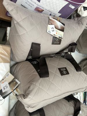 a pile of pillows that are stacked on top of each other