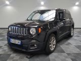 the black jeep is parked in the garage on a checkered floor