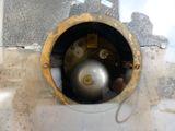 a metal ball that is in a hole in the wall