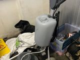 a small machine that is sitting next to a pile of trash