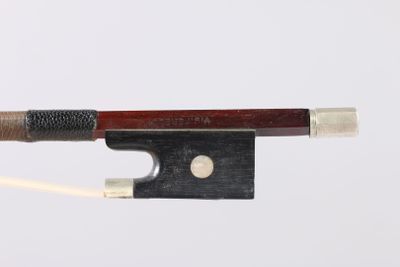 a close up of a violin bow on a white background