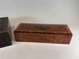 pair of antique wooden boxes on white background with one open and the other closed