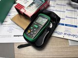 a cell phone sitting on top of a box on a desk