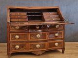 a wooden desk with drawers and drawers on top of it